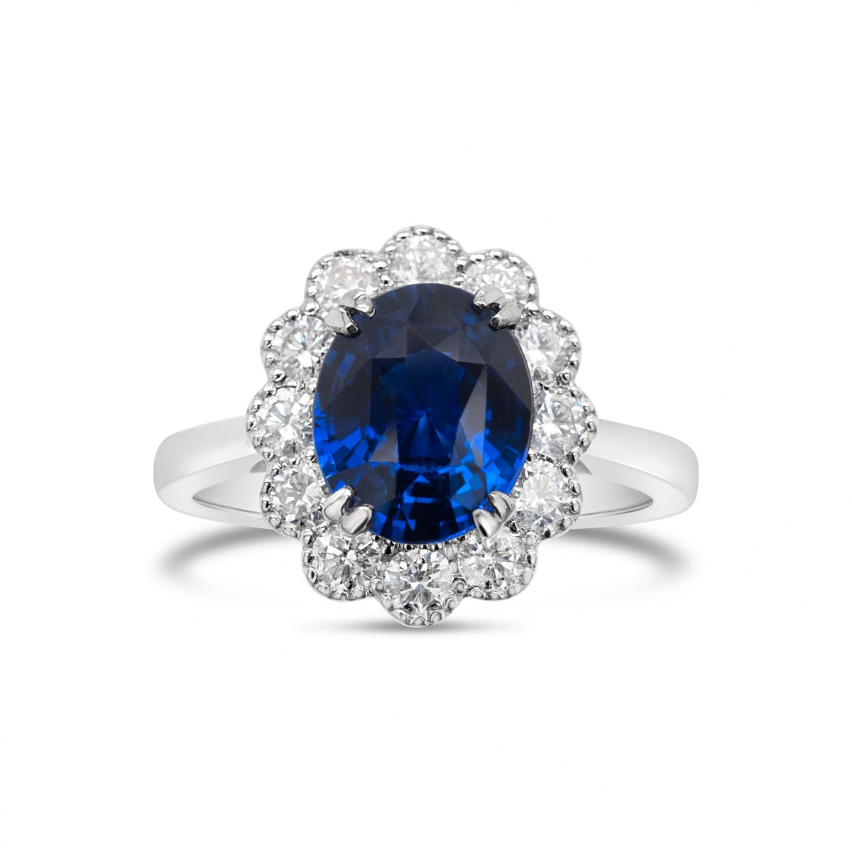 3.03ct Oval Royal Blue Sapphire & 0.55ct Diamond 18ct White Gold Cluster Ring