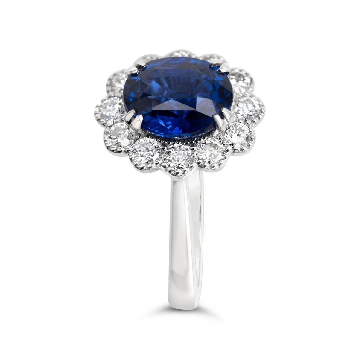 3.03ct Oval Royal Blue Sapphire & 0.55ct Diamond 18ct White Gold Cluster Ring