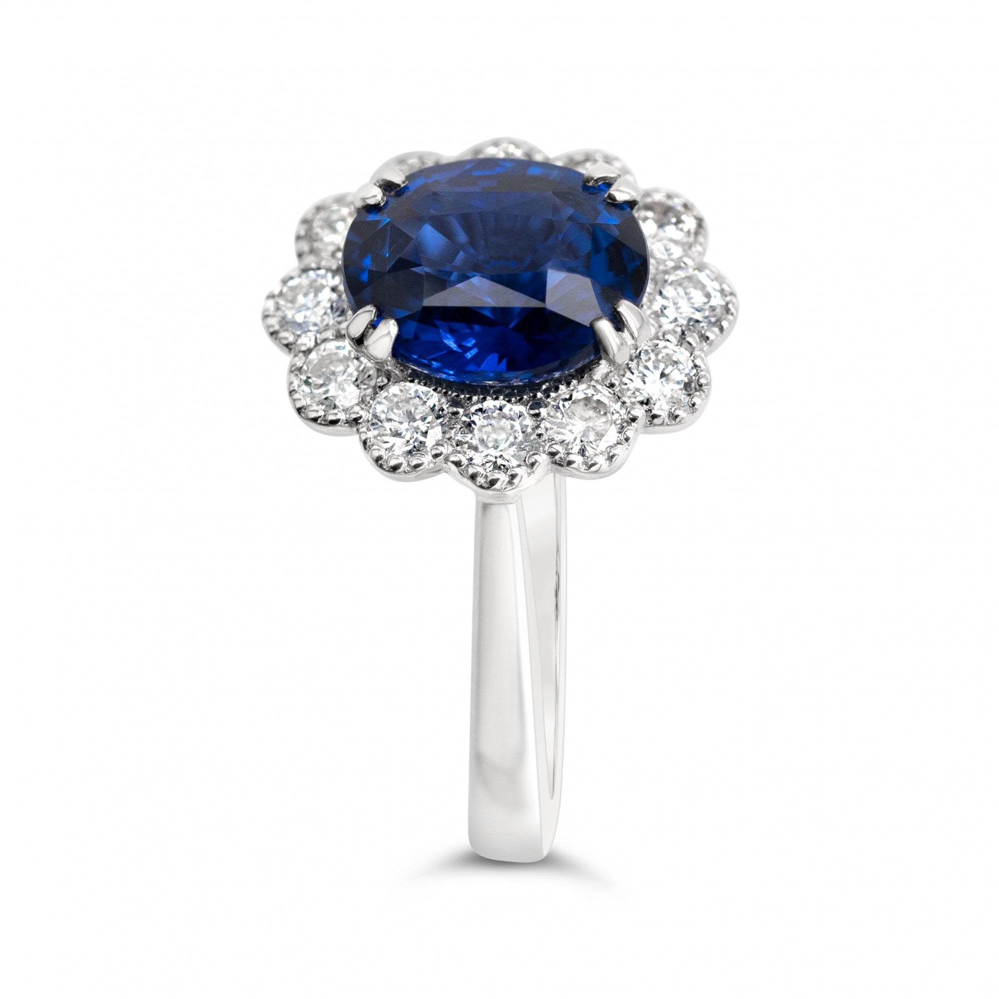 3.03ct Oval Royal Blue Sapphire & 0.55ct Diamond 18ct White Gold Cluster Ring