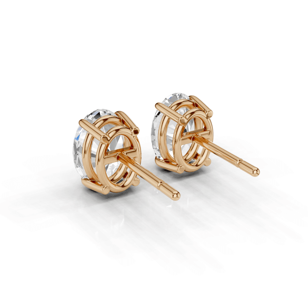 Oval Cut Diamond 4 Claw Stud Earrings