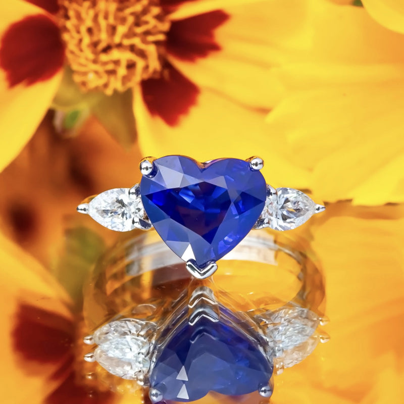 18ct White Gold 4.63ct Sapphire and 0.47ct Pear Cut Diamond Ring