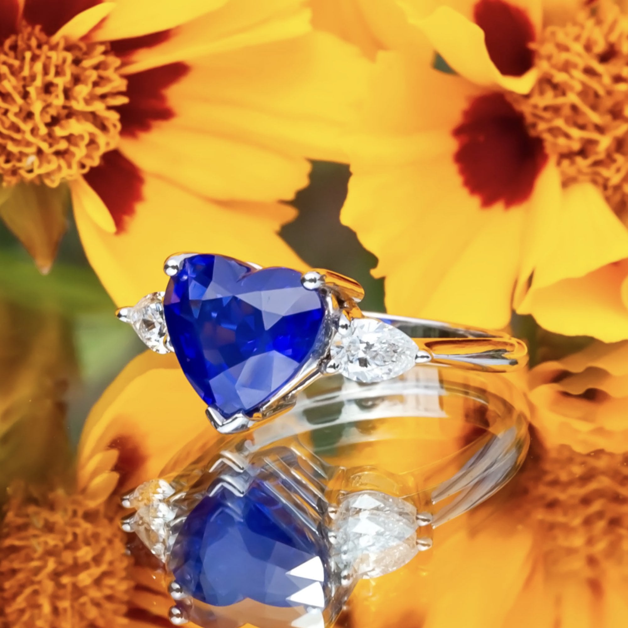 18ct White Gold 4.63ct Sapphire and 0.47ct Pear Cut Diamond Ring