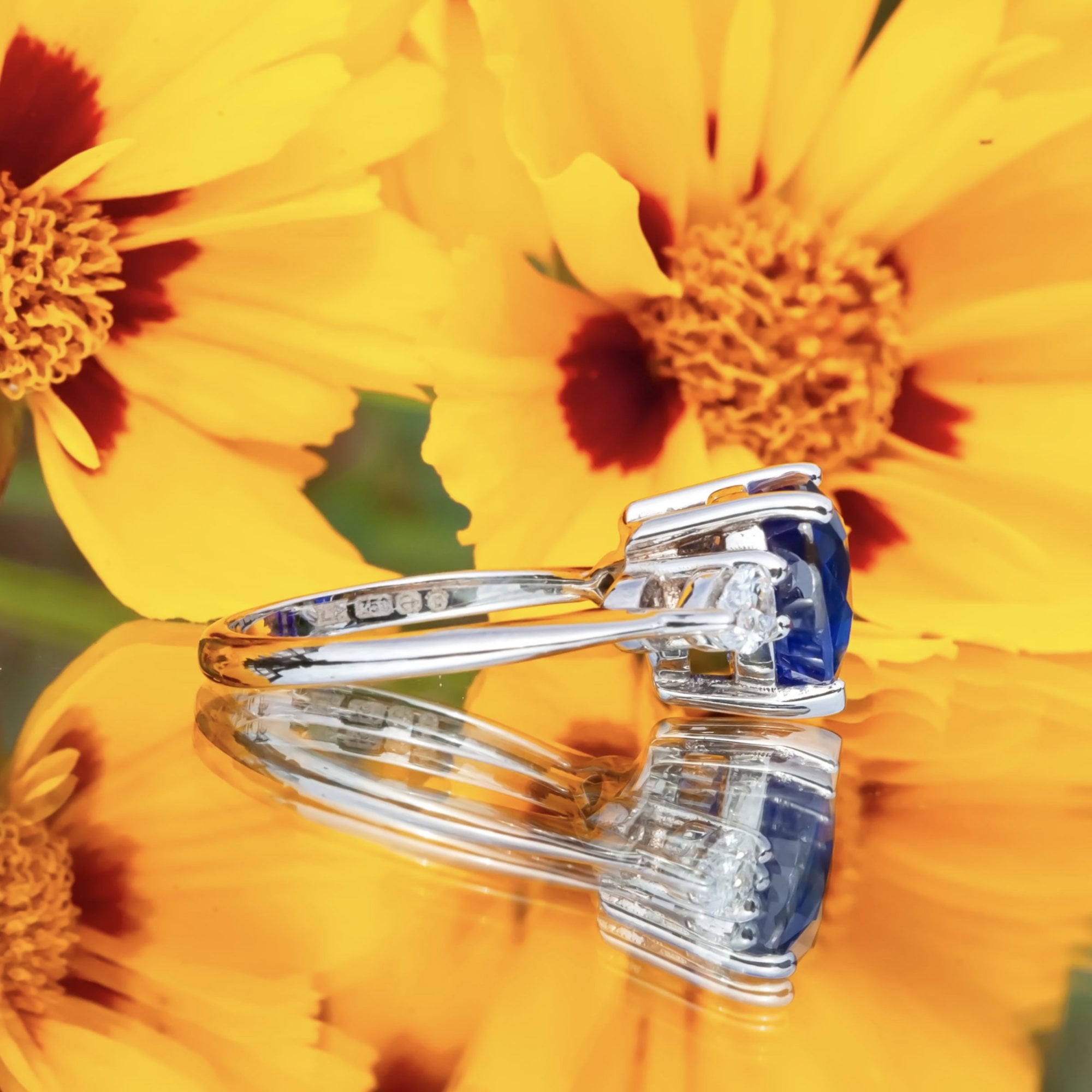 18ct White Gold 4.63ct Sapphire and 0.47ct Pear Cut Diamond Ring