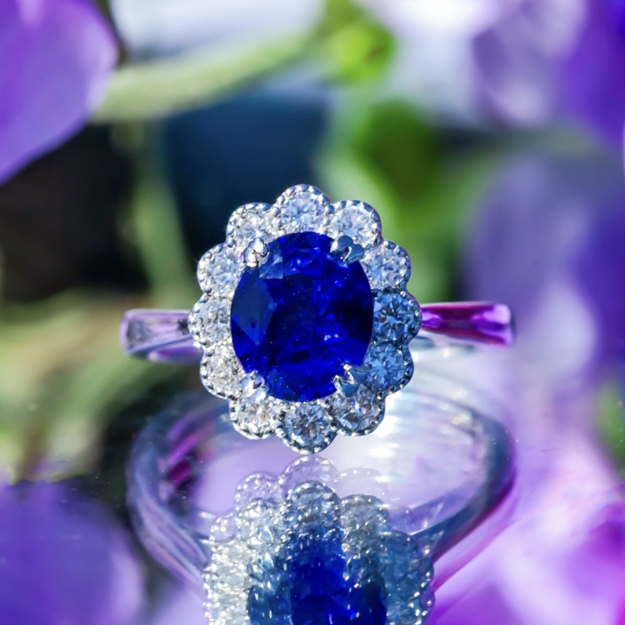 3.03ct Oval Royal Blue Sapphire & 0.55ct Diamond 18ct White Gold Cluster Ring