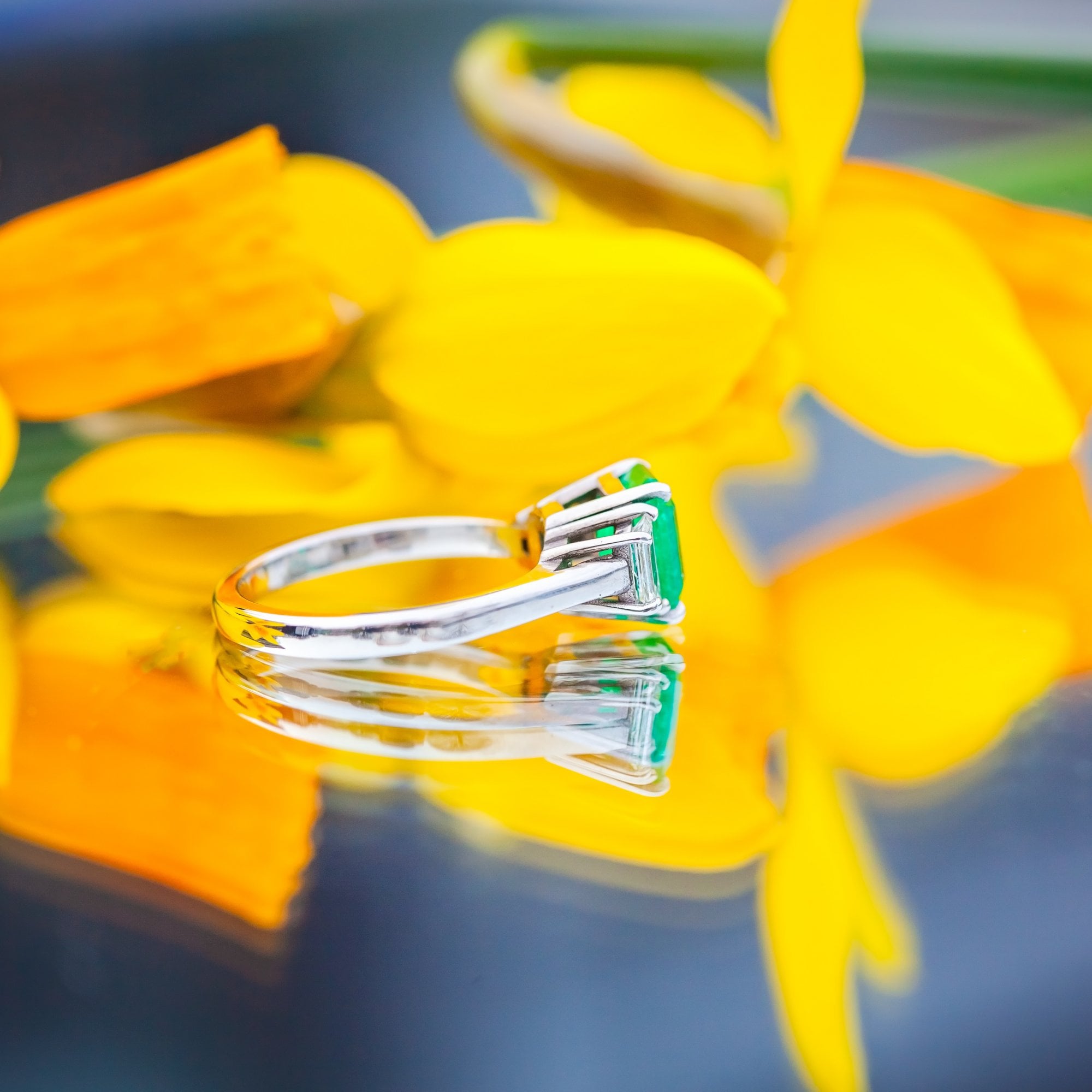 18ct White Gold 1.72ct Columbian Emerald and 0.41ct Diamond Trilogy Ring