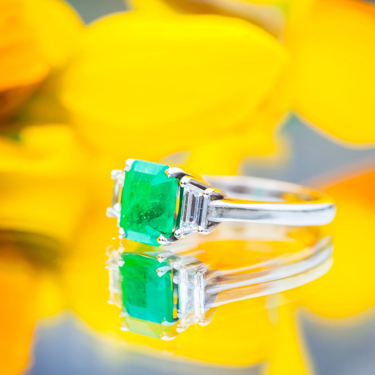 18ct White Gold 1.72ct Columbian Emerald and 0.41ct Diamond Trilogy Ring