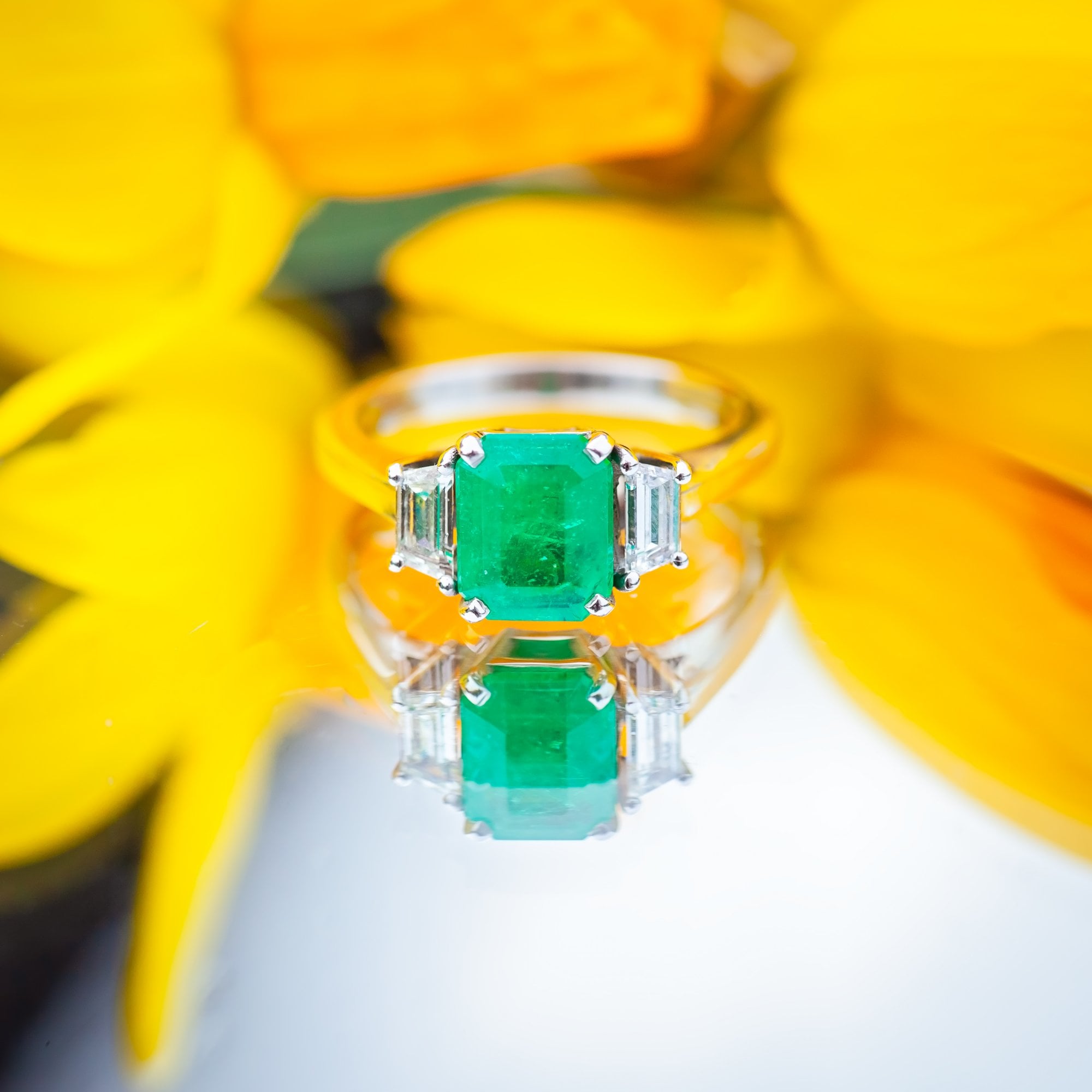 18ct White Gold 1.72ct Columbian Emerald and 0.41ct Diamond Trilogy Ring